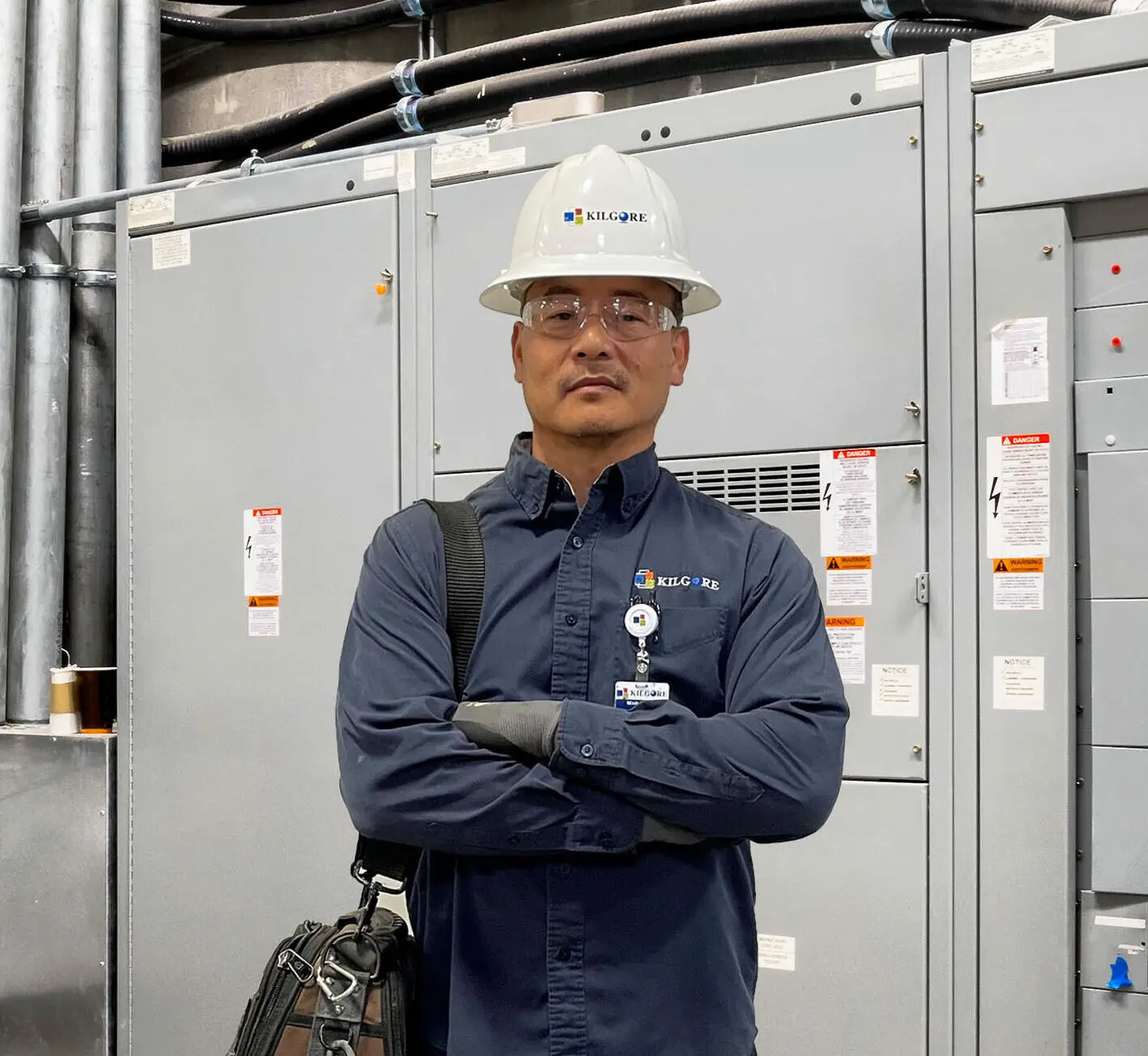 Electrical Technician repairing electrical room and lighting installation.